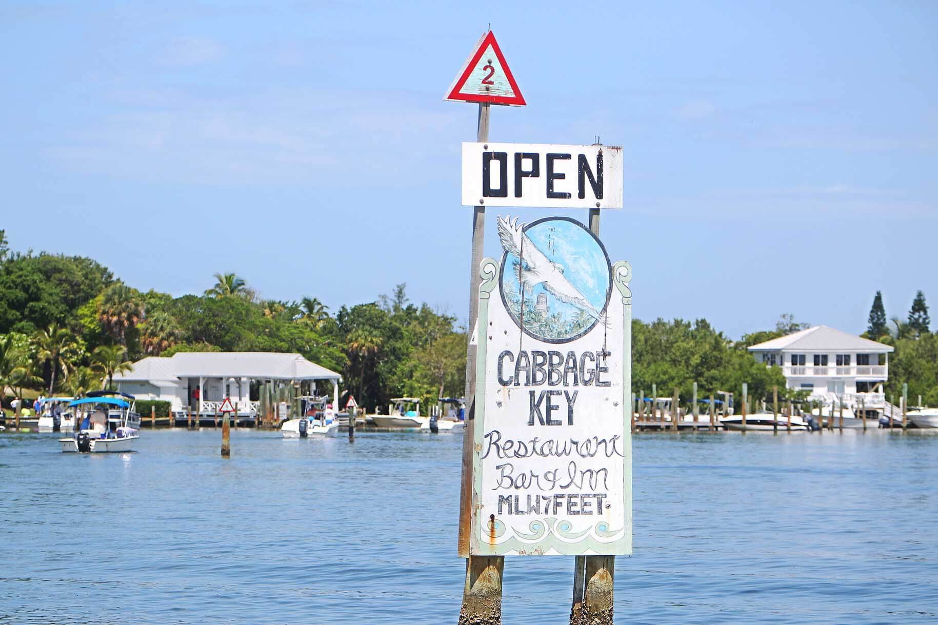 Boaters first view a sign in Pine Island Sound that marks the channel leading to Cabbage Key, seen in the background.