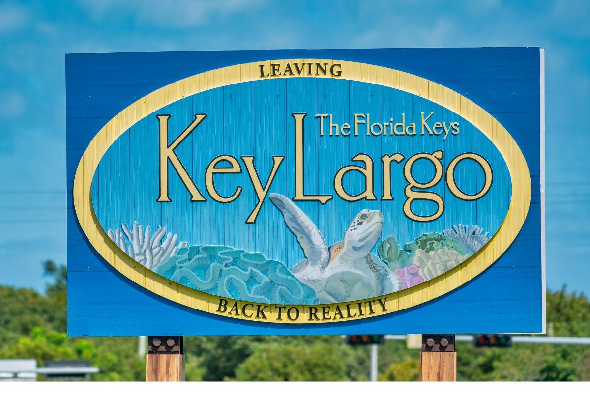 Sign that says The Florida Keys Key Largo Back to Reality. 