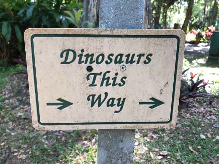 Photo of a sign that says Dinosaurs this Way
