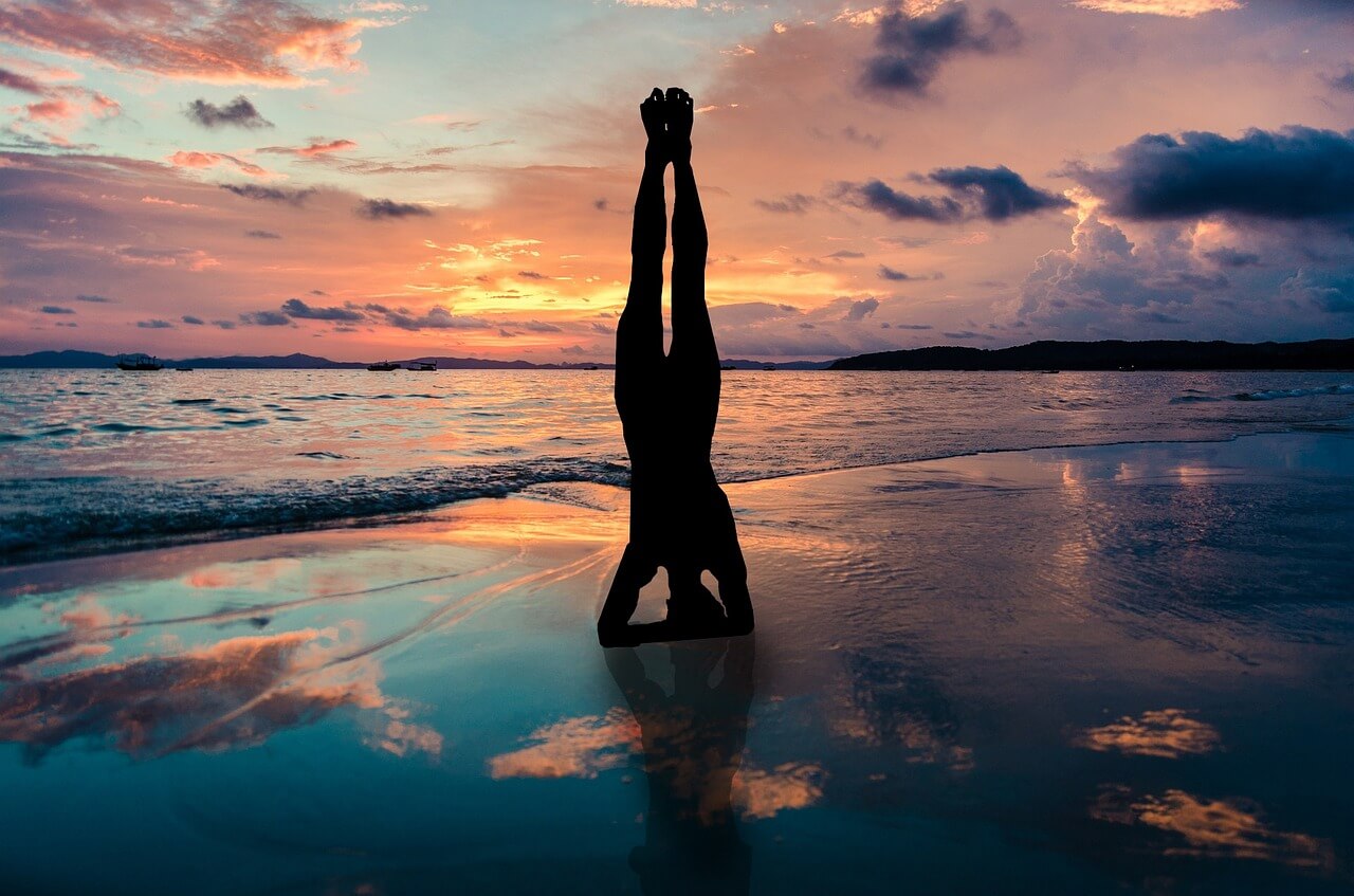 Yoga on the beach at sunset
