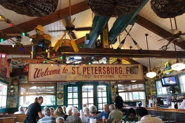 Photo of a sign in a restaurant that says Welcome to St Petersburg