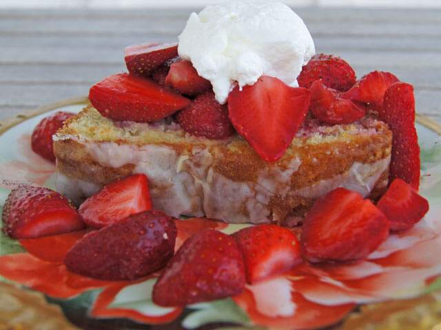 Photo of a pound cake with strawberries