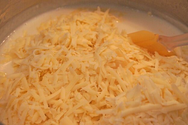 Photo of cheese being added to cream
