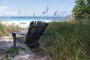 Photo of chair on beach perfect for reading