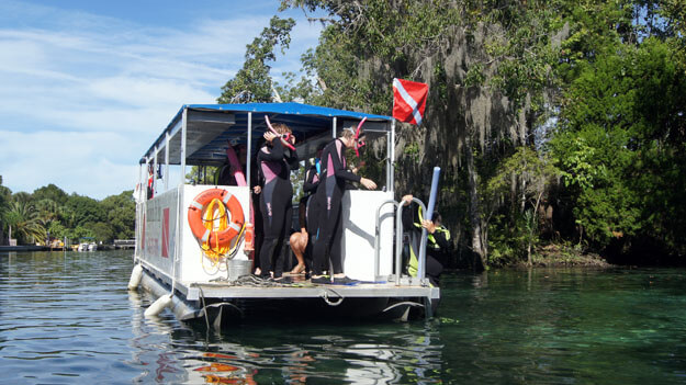 Divers on a boat.