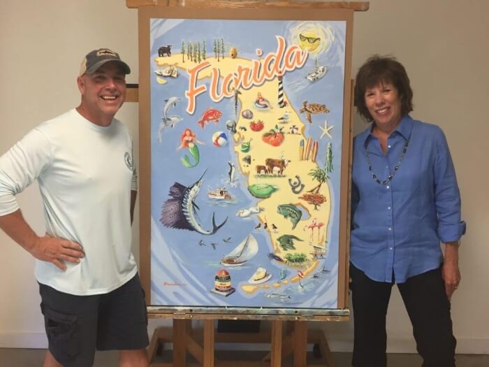 Photo of Robin Draper and Brendan Coudal in front of an Authentic Florida poster