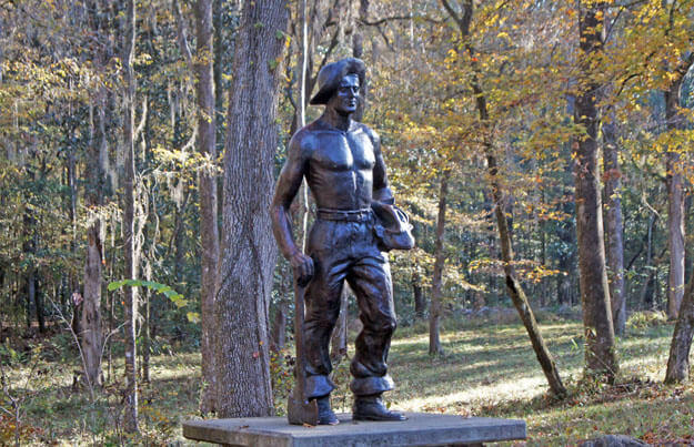 Photo of a statue of a cave worker