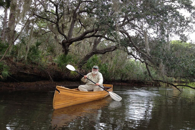 Photo of Clyde Butcher in a canoe