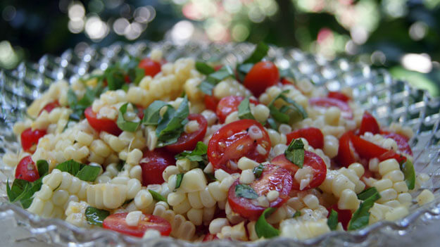 Photo of a corn and tomato salad