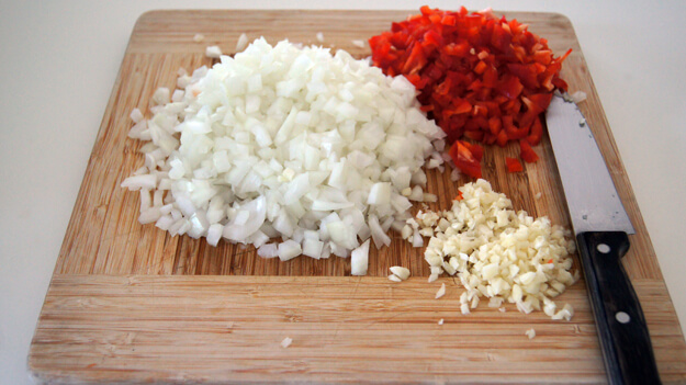 Photo of cut up peppers and onions