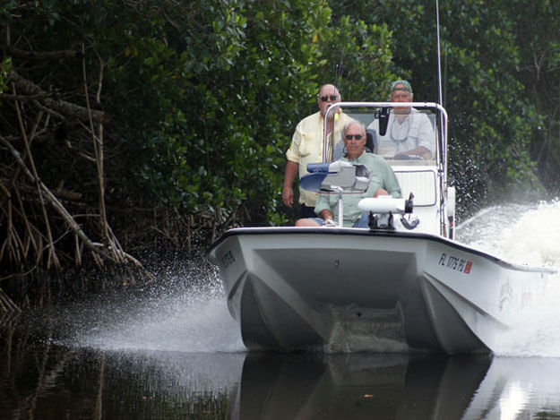 Photo of fishers in a boat on the Everglades