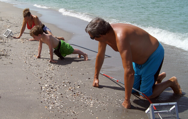 Photo of Family looking for shark teeth on the beach