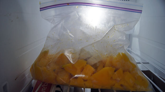 Fresh mango cut up and placed in the refrigerator for a mango smoothie.