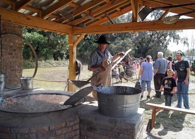 Photo of a man making cane syrup