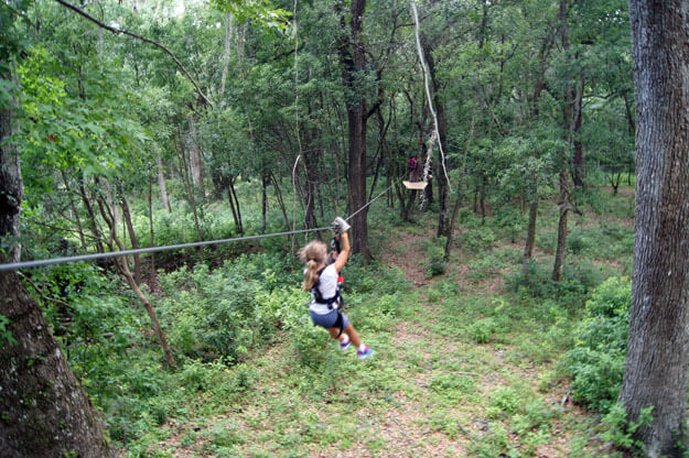 Photo of a girl zip lining