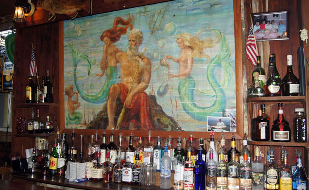 Photo of the King Neptune mural at the Island Hotel Bar