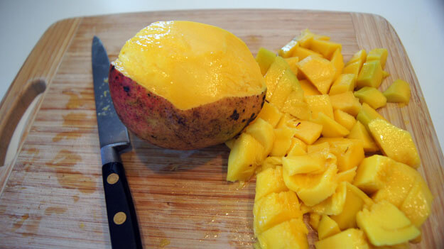 Fresh mango cut up for a mango smoothie