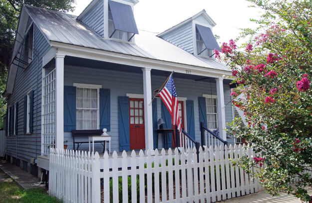 Photo of a house with an American flag