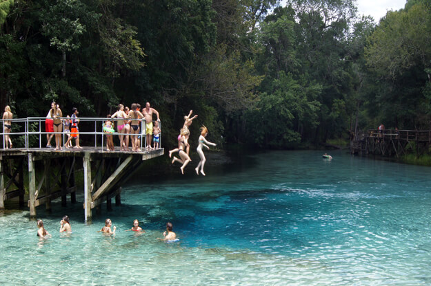 Photo of people jumping in Gilchrist Springs