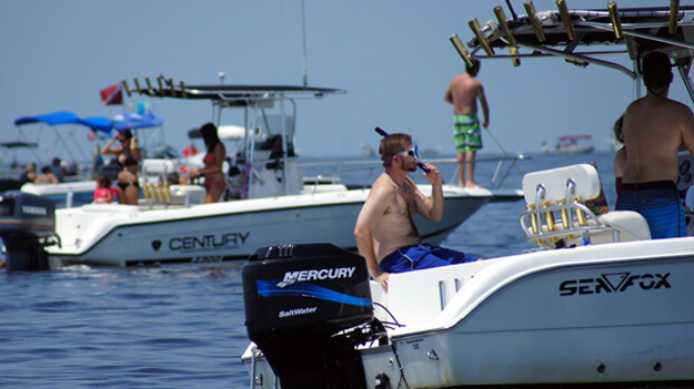 Photo of a man on a boat ready to go scalloping