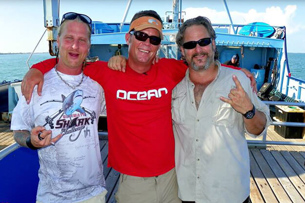 Photo of the Shark Brothers on a boat