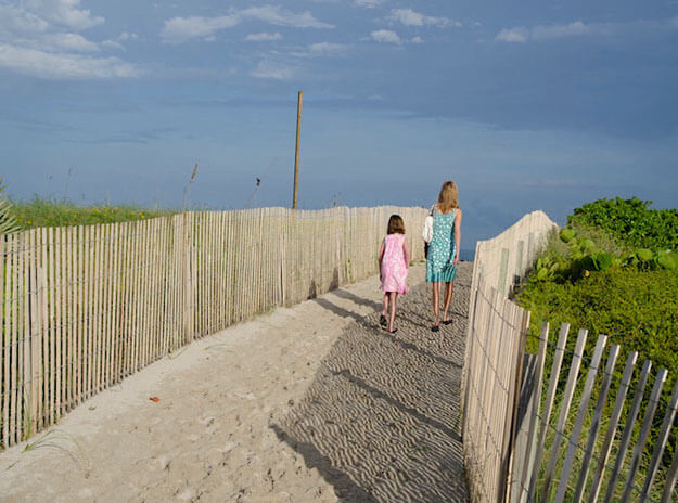 Photo of two girls walking to the beach