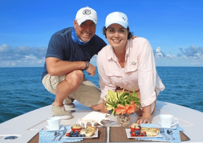 Photo of Brendan and Nicole Coudal on a boat