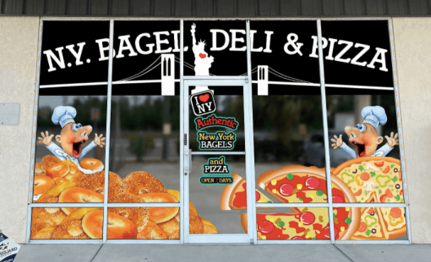 Restaurant entry with a sign that reads N.Y. Bagel Deli & Pizza. 