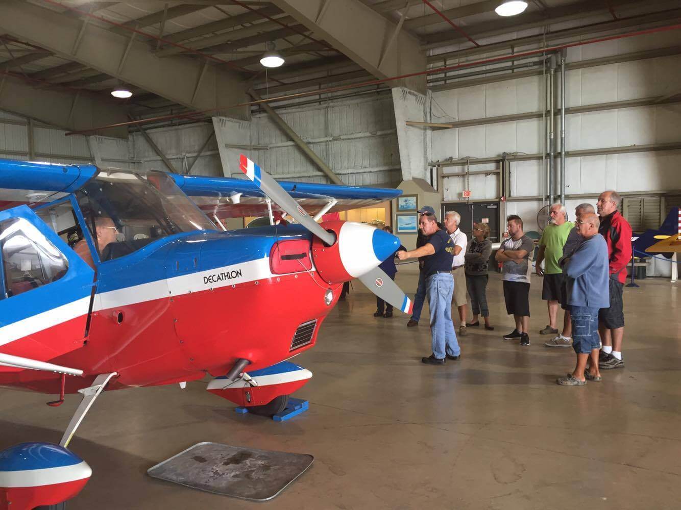 People Viewing a Vintage Plane at Wings Over Miami Museum in Miami Florida