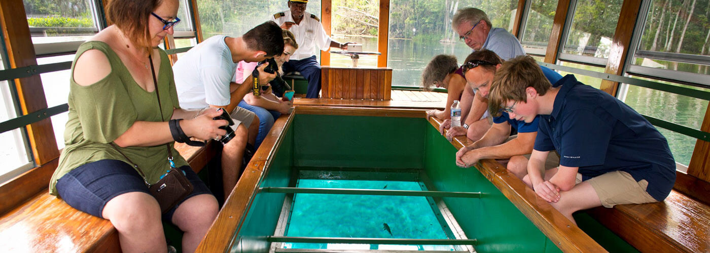 People on a glass bottom boat at Silver Springs.