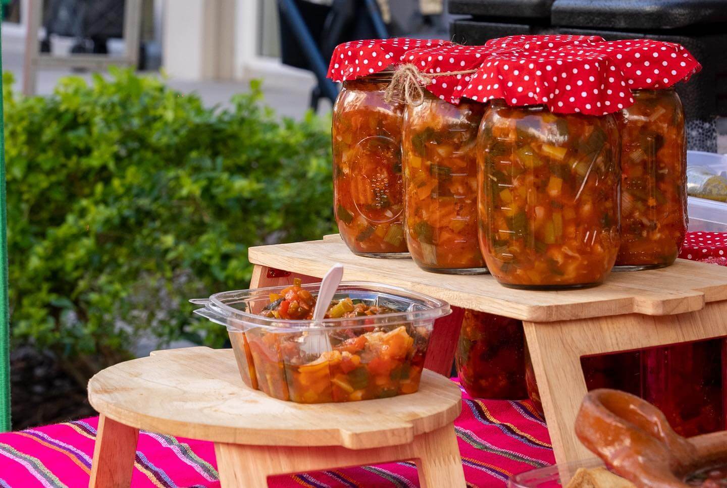 Salsa on a table with samples for Florida Farmer's Market.  