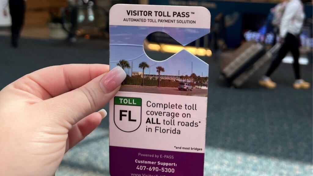 Visitor Toll Pass held in airport