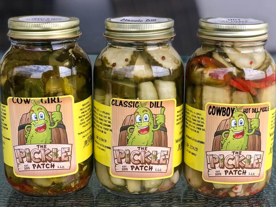 Jars of pickles with the label that reads The Pickle Patch. 