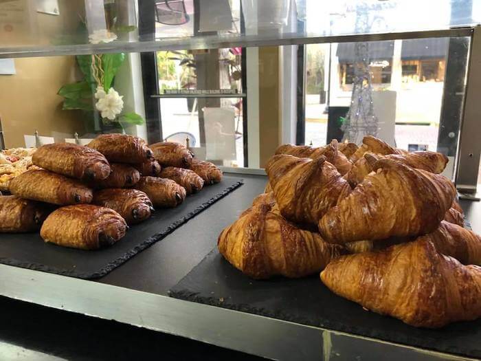 Photo of croissants in a bakery case