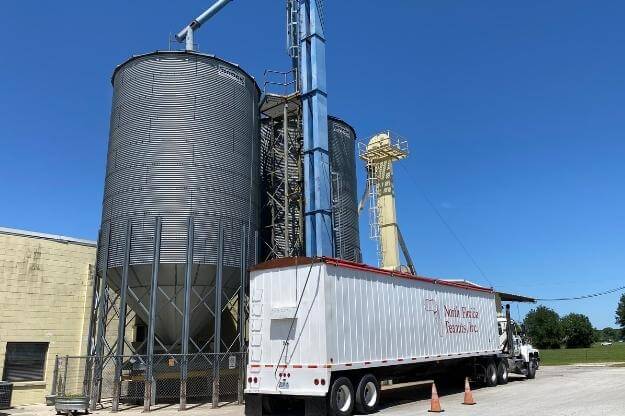 Photo of truck unloading peanuts at Williston Peanut Factory