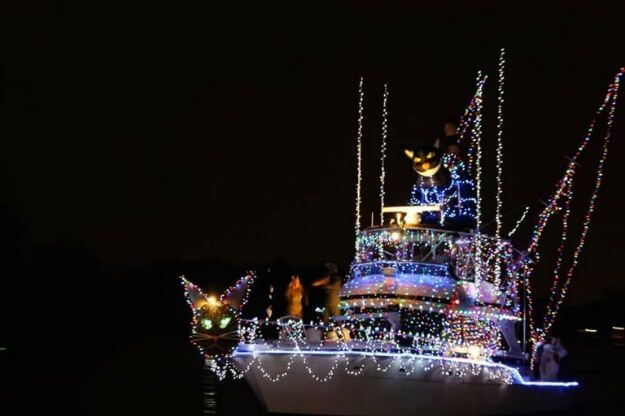 Photo of a boat decorated in Christmas lights