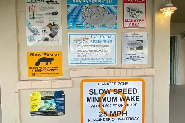 Manatee safety signs on a wall. 
