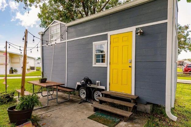 Tiny house with a yellow door. 