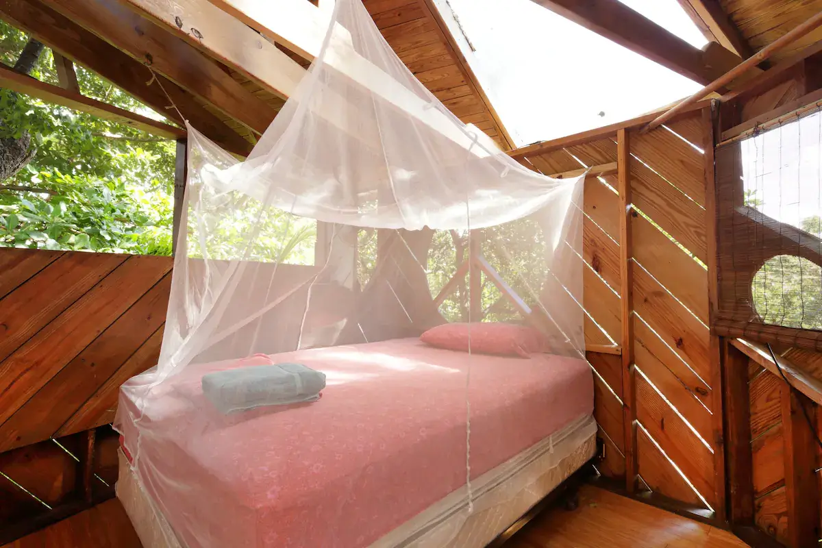Bed in a treehouse airbnb