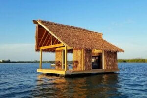 Photo of a tiki cabin in the water