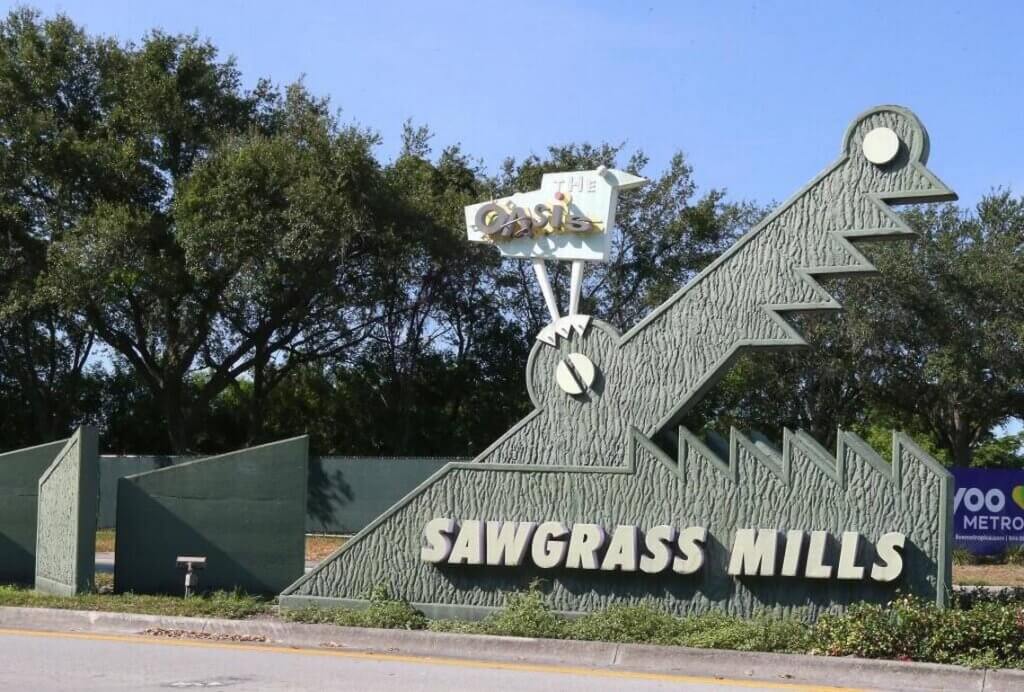 Sawgrass Mills sign that includes The Oasis