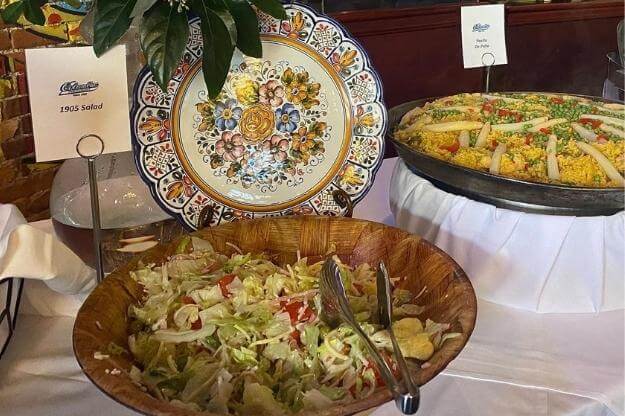 Columbia Restaurant 1905 salad and paella dislay