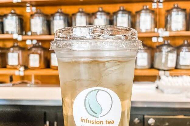 Iced tea with a label of Infusion Tea on the front. 