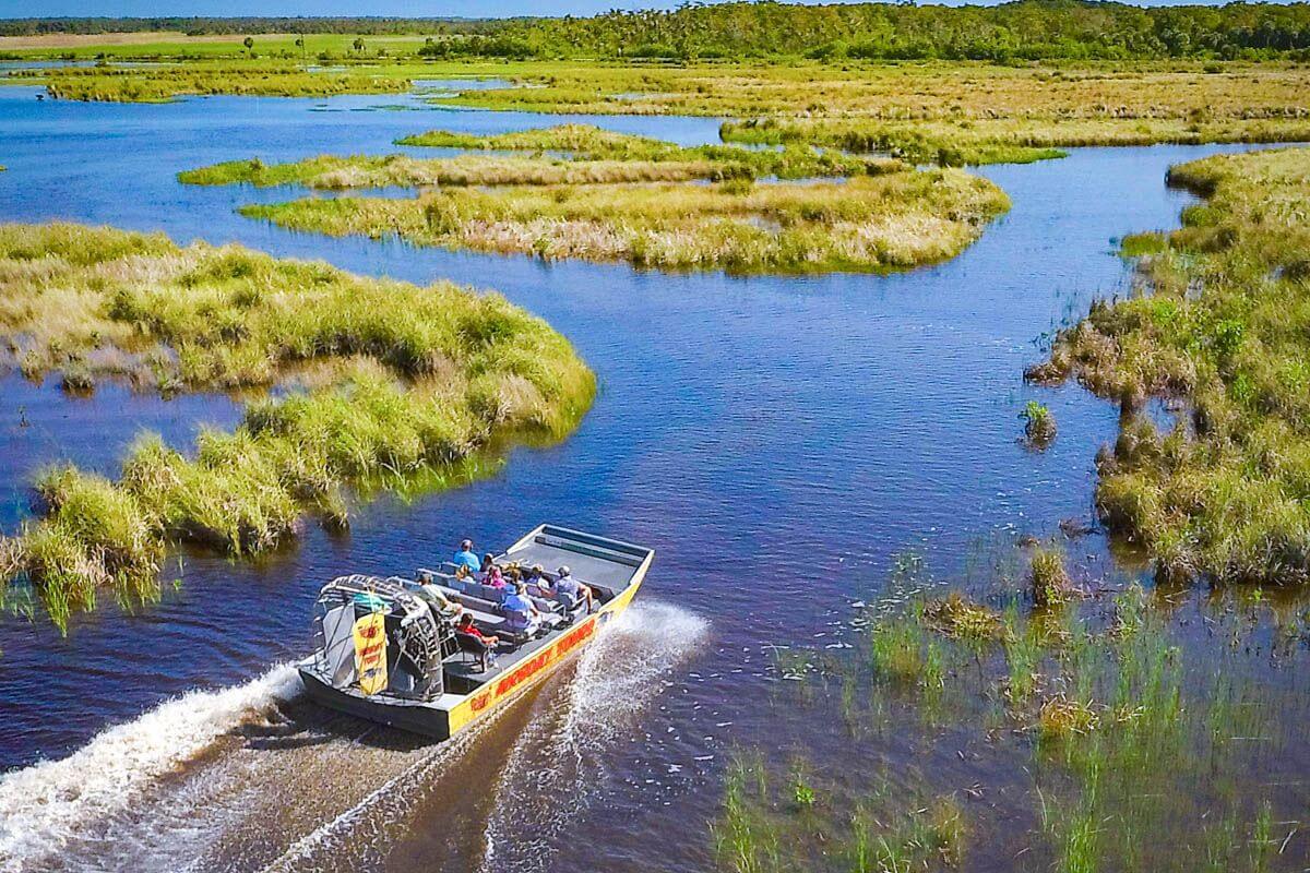 aerial shot of airboat in water
