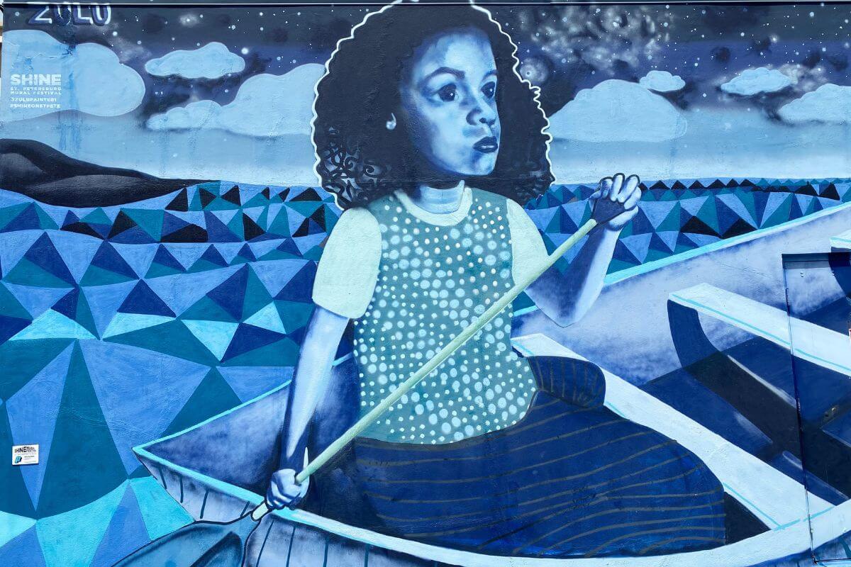 St. Pete mural of a girl in a boat. 