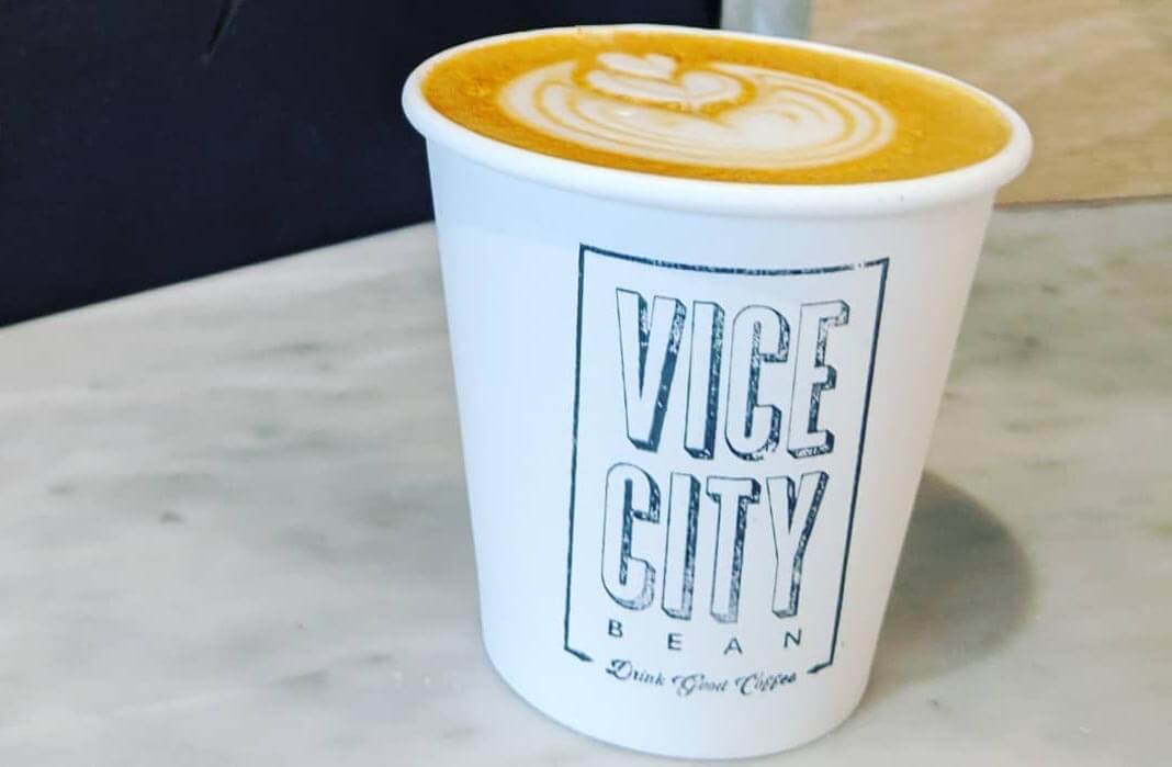 Cup of coffee and the cup says Vice City Bean. 