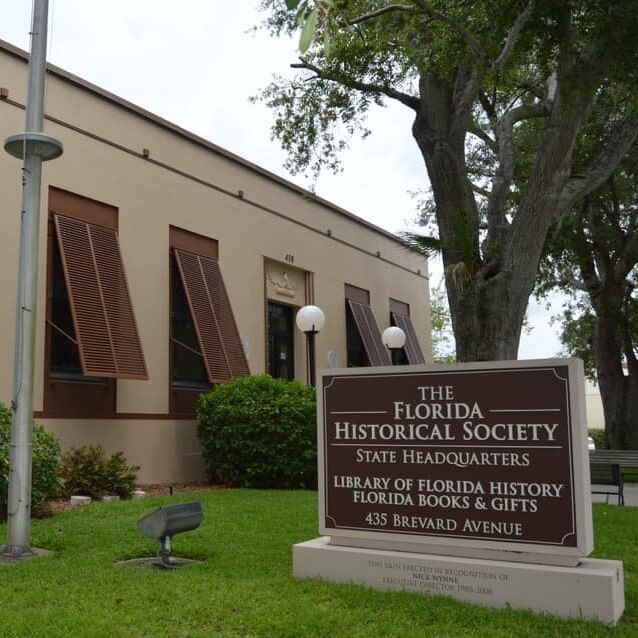 Sign that reads The Florida Historical Society State Headquarters Library of Florida History Florida Books and Gifts. 
