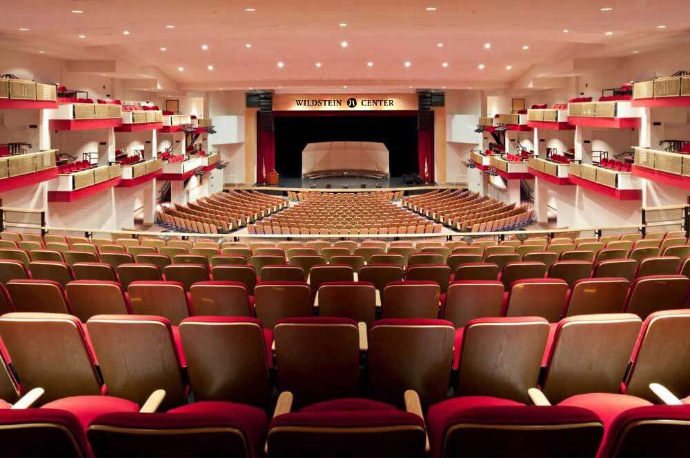 Theater interior with wording that says Wildstein Center above the stage 
