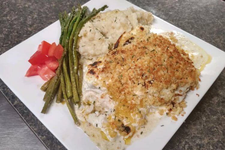 Castaways Restaurant creamy crab stuffed flounder with mashed potatoes and asparagus