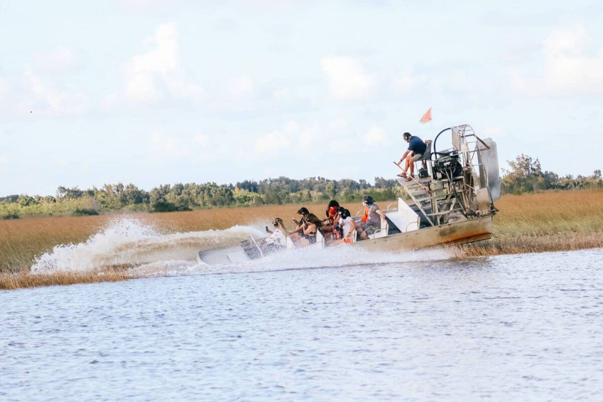 Group riding in air boat. 